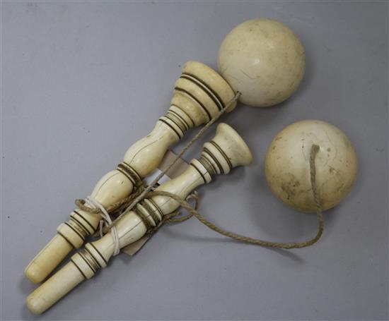 Two ivory cup and ball toys